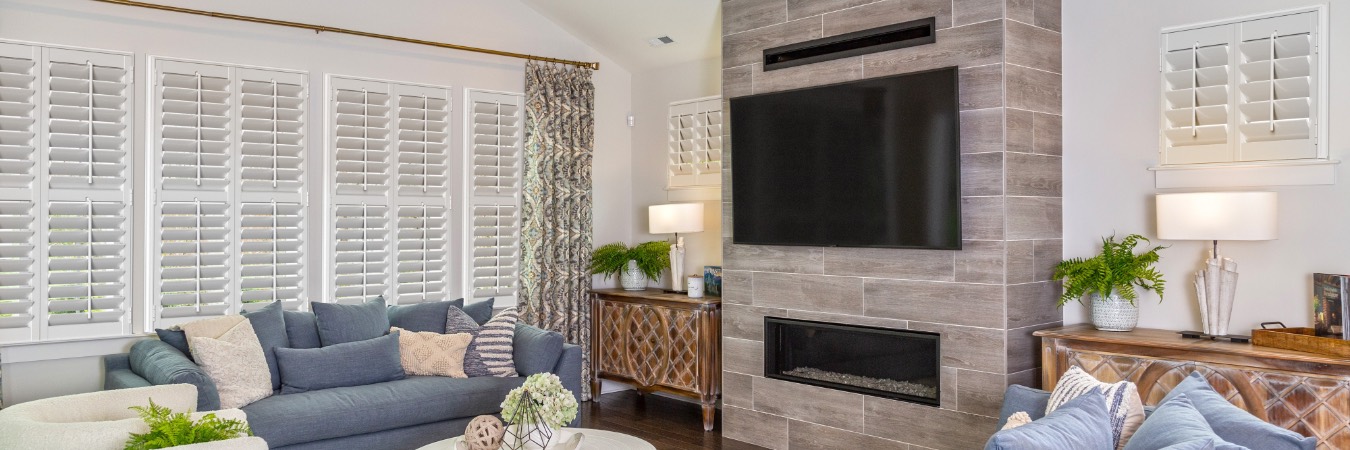 Interior shutters in Huntington family room with fireplace