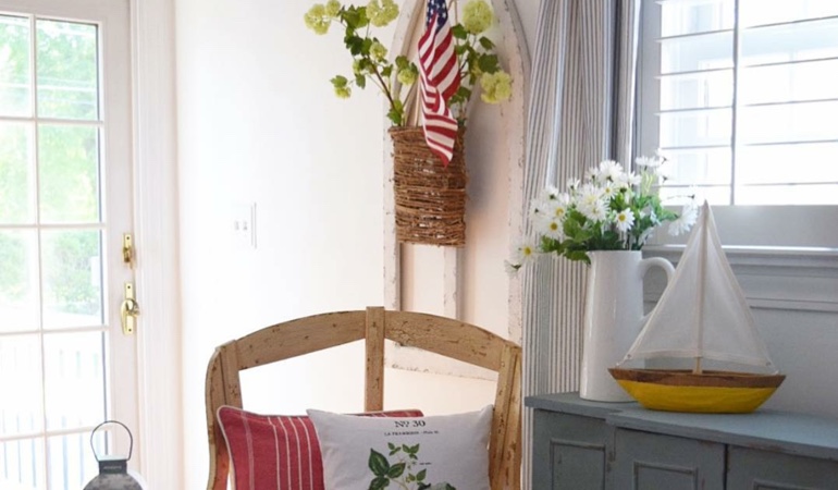Bright sitting corner with faux wood plantation shutters in New York. Faux wood plantation shutters in New York