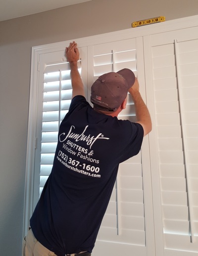 Shutter installation in New York bedroom.