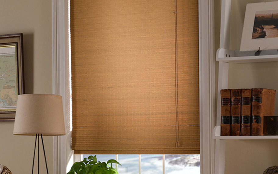 Add a touch of nature to your decor with woven fiber shades in New York. Tan woven fiber shades in a living room