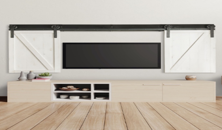 Barn-door shutters around a TV in New York.