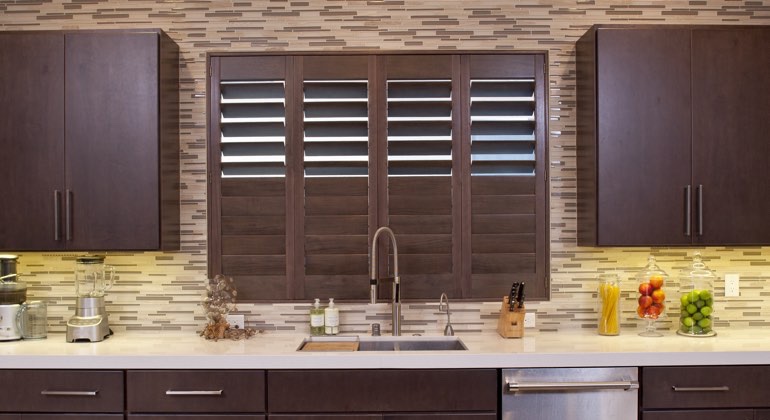Divider rail shutters in a New York kitchen. New York cafe kitchen shutters