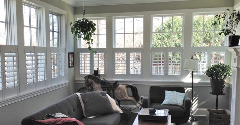 Cafe shutters in a sunroom in New York. New York cafe shutters sun room