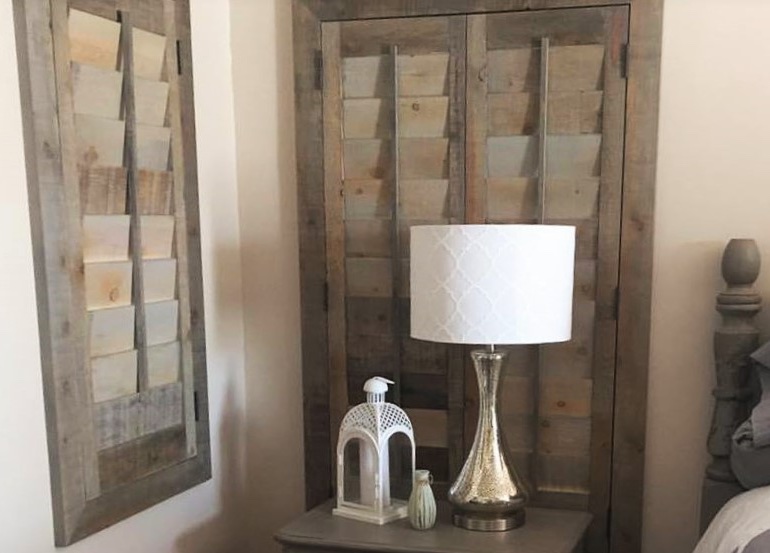 New York bedroom with reclaimed wood shutters.