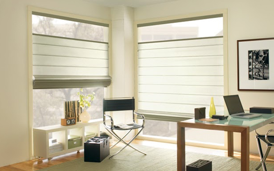 Upgrade your windows with stylish window shades or shutters in New York. Stylish sheer shades in the corner of a modern office.
